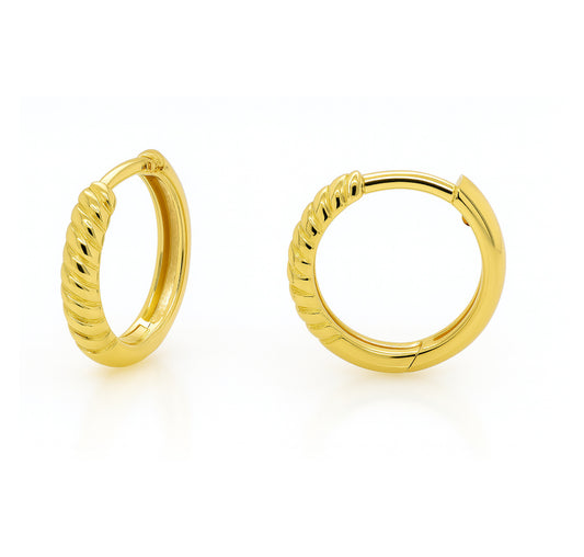 Gold hoop earrings on a white background