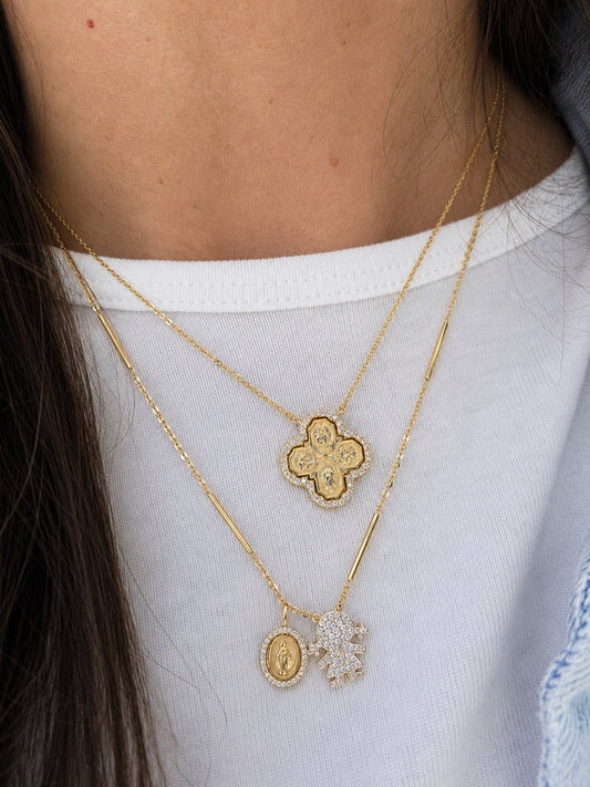 How to Layer Religious Gold Pendants: A Guide to Sacred Style