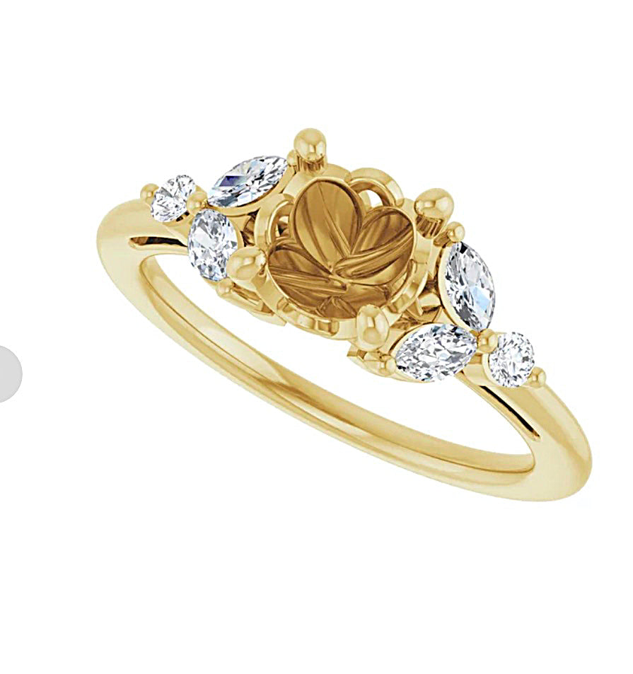 Gold engagement ring semi-mount with a  fancy design prongs  and diamond accents on a white background