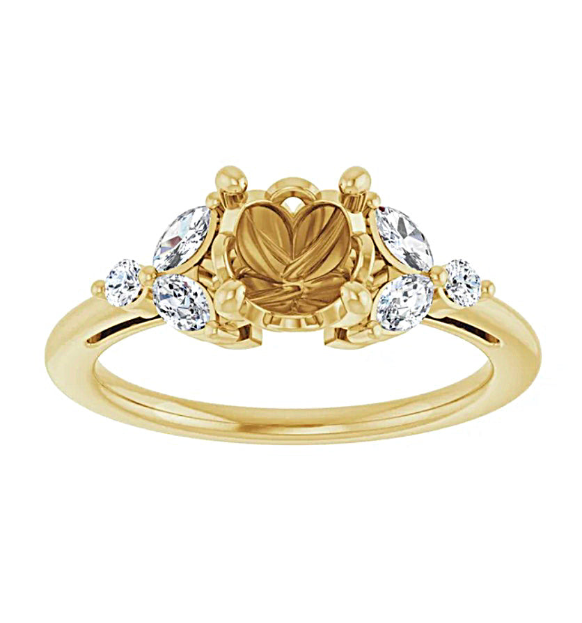 Gold engagement ring semi-mount with a  fancy design prongs  and diamond accents on a white background