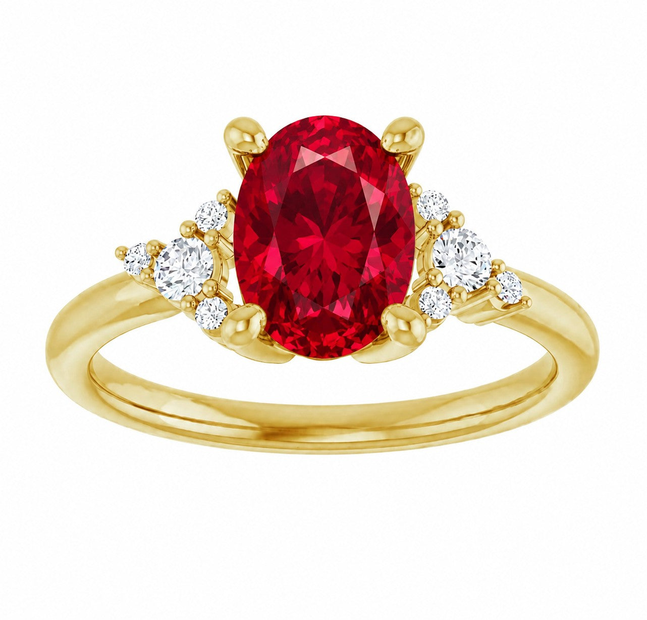 Gold engagement ring with an oval cut red ruby gemstone and smaller diamonds on a white background