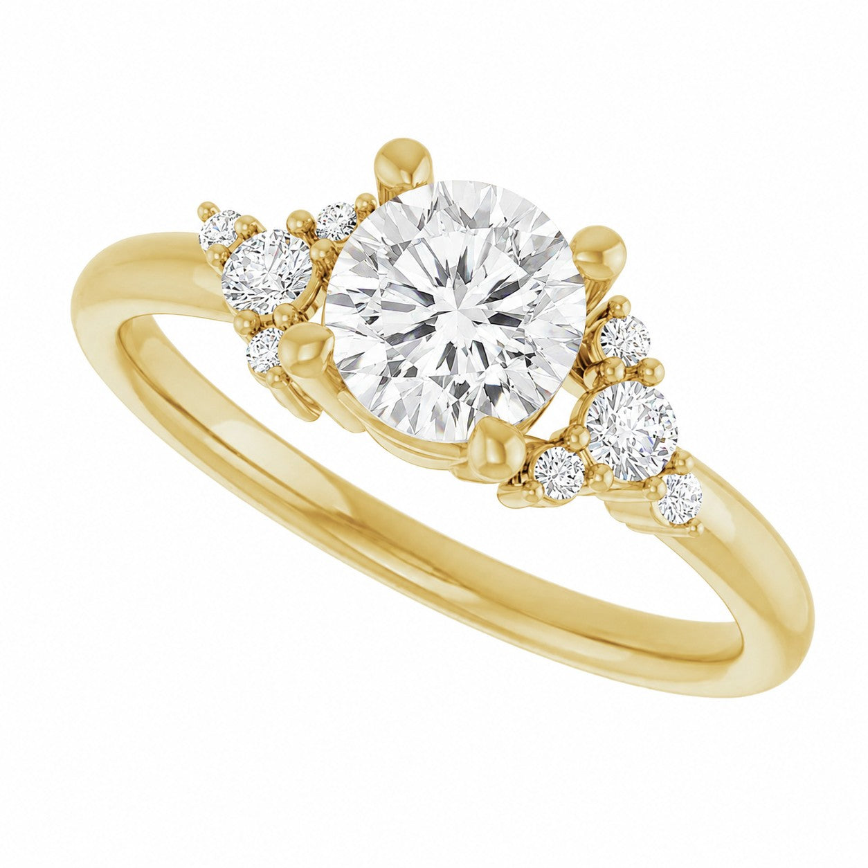 Gold engagement ring with a central round diamond and smaller diamonds on a white background