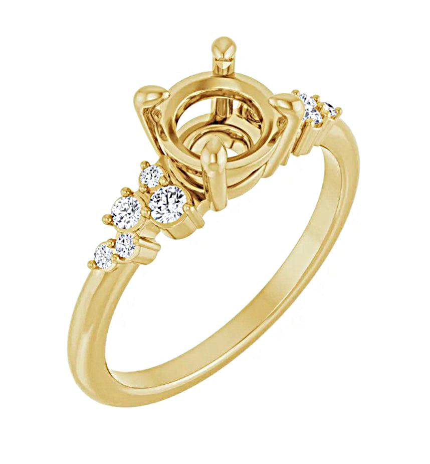 Angled view of a Gold engagement ring semi-mount with a decorative design and small diamonds on a white background