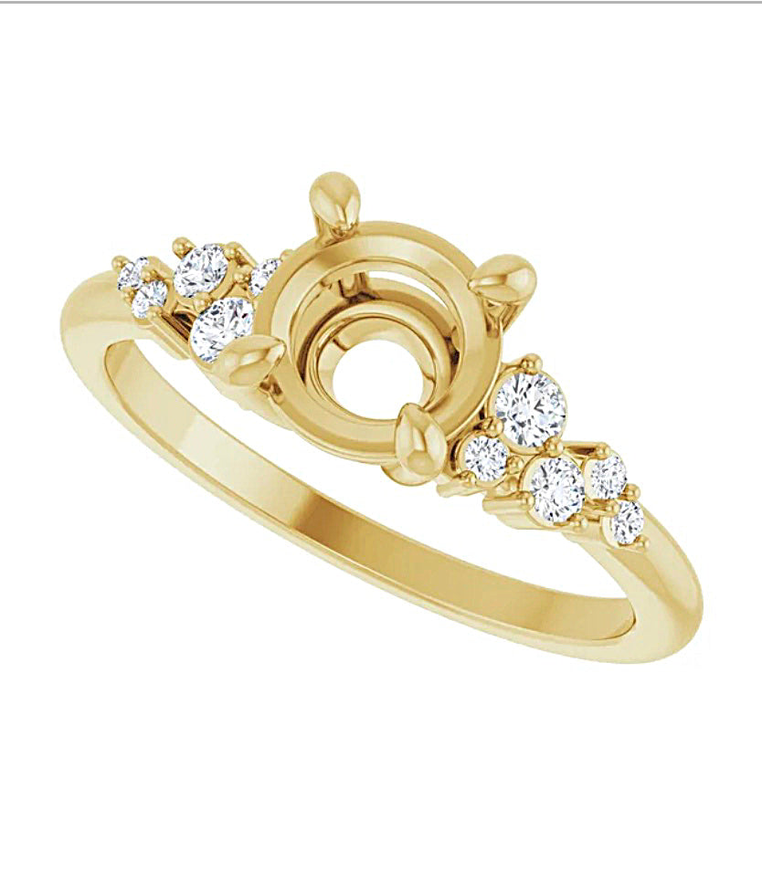 Angled view of a Gold engagement ring semi-mount with diamond accents on a white background