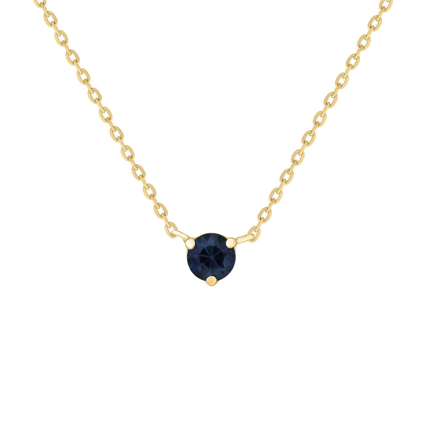 A gold necklace featuring a solitaire blue sapphire gemstone as the centerpiece, with a subtle sparkle.