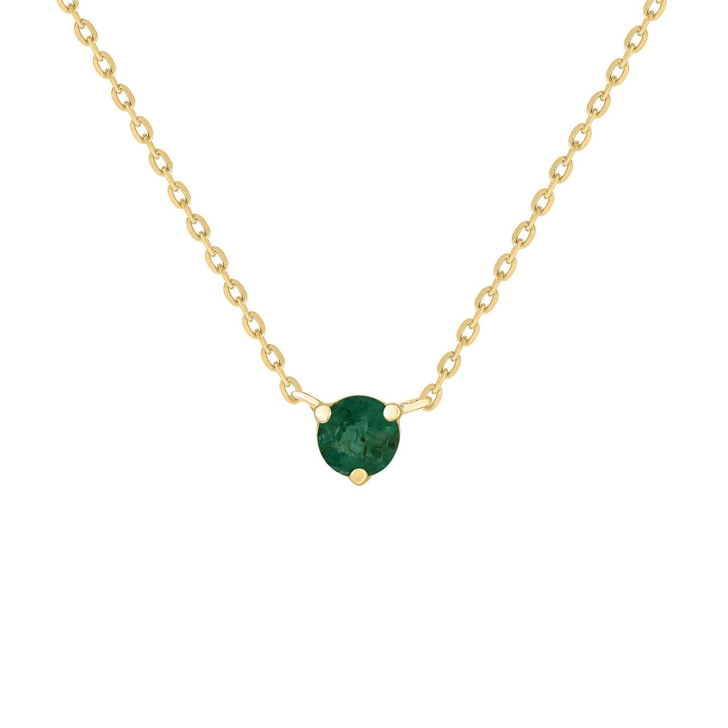 A gold necklace featuring a solitaire emerald gemstone as the centerpiece, with a subtle sparkle.