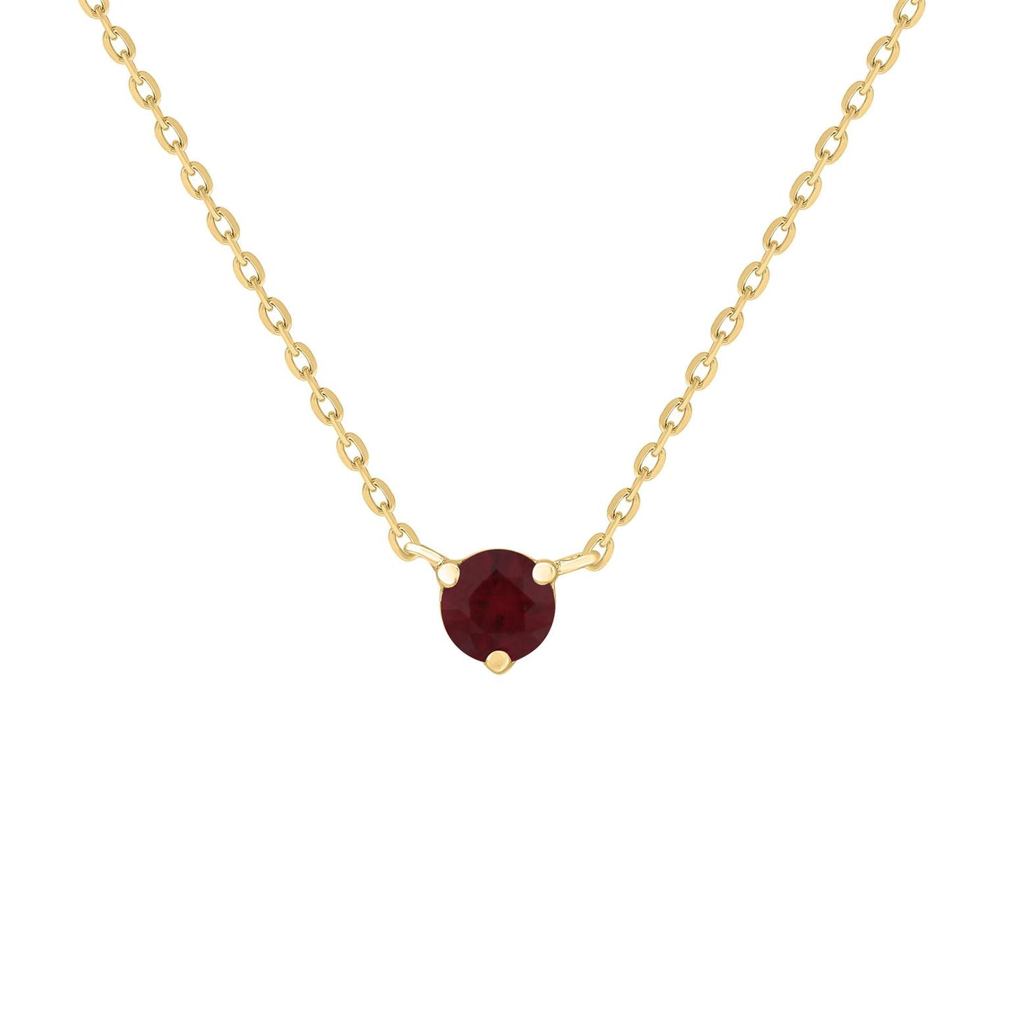 A gold necklace featuring a solitaire ruby gemstone as the centerpiece, with a subtle sparkle.
