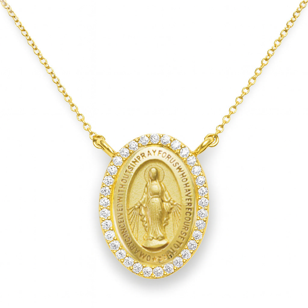 Gold necklace with a religious diamond miraculous pendant on a cable chain in a white background