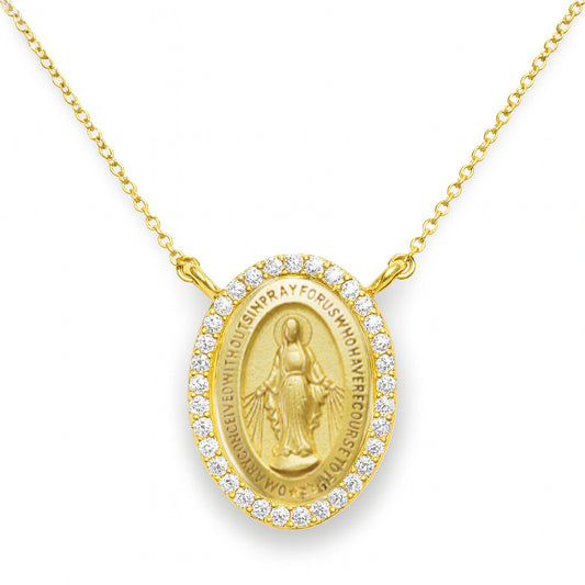 Gold necklace with a religious diamond miraculous pendant on a cable chain in a white background
