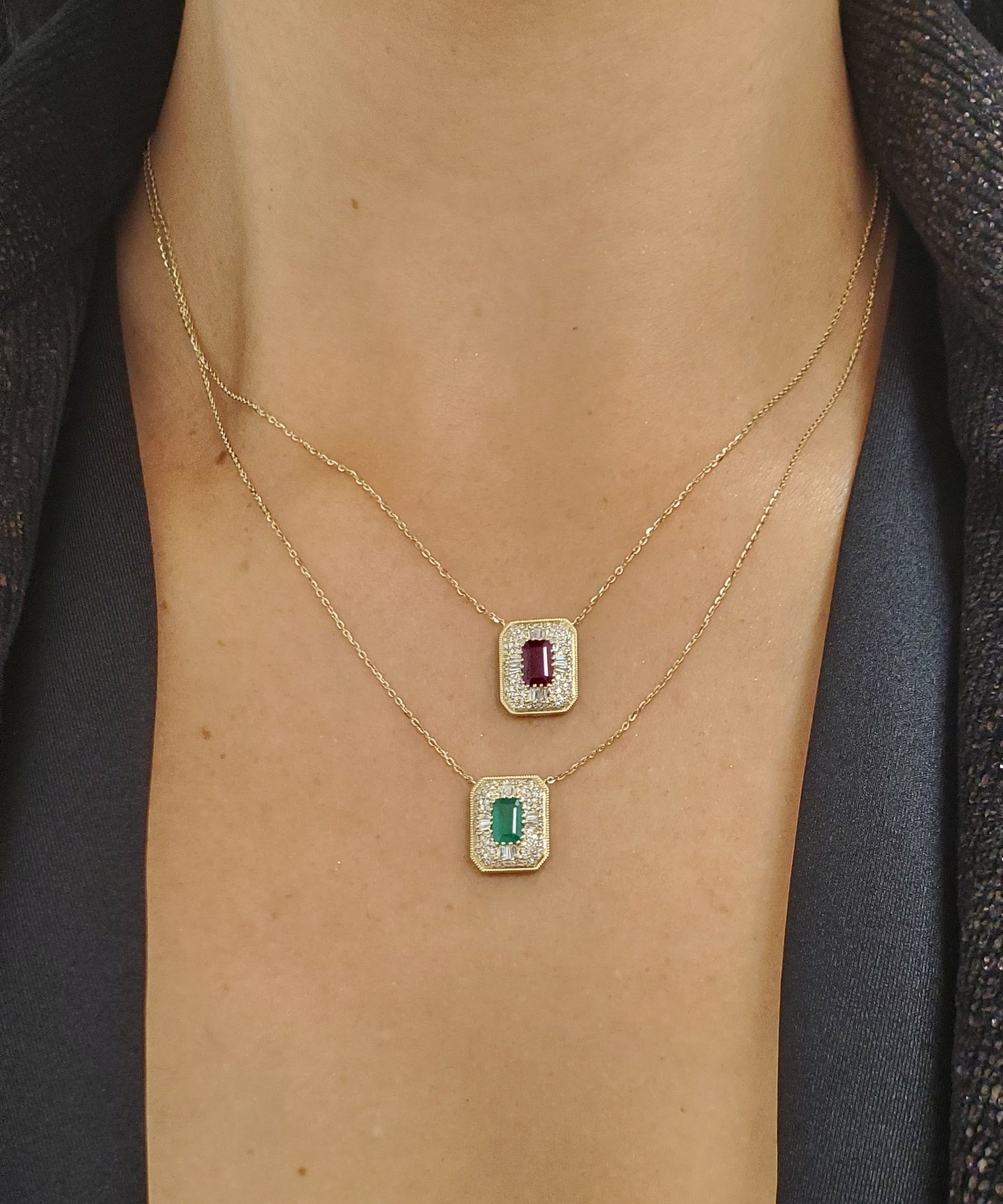 Necklace with gemstone pendants on a person's neck