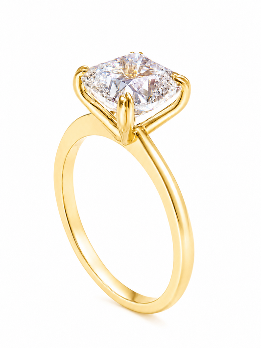 A yellow gold solitaire engagement ring featuring a large square cushion-cut diamond in a four-prong setting, shown on a clean white background.