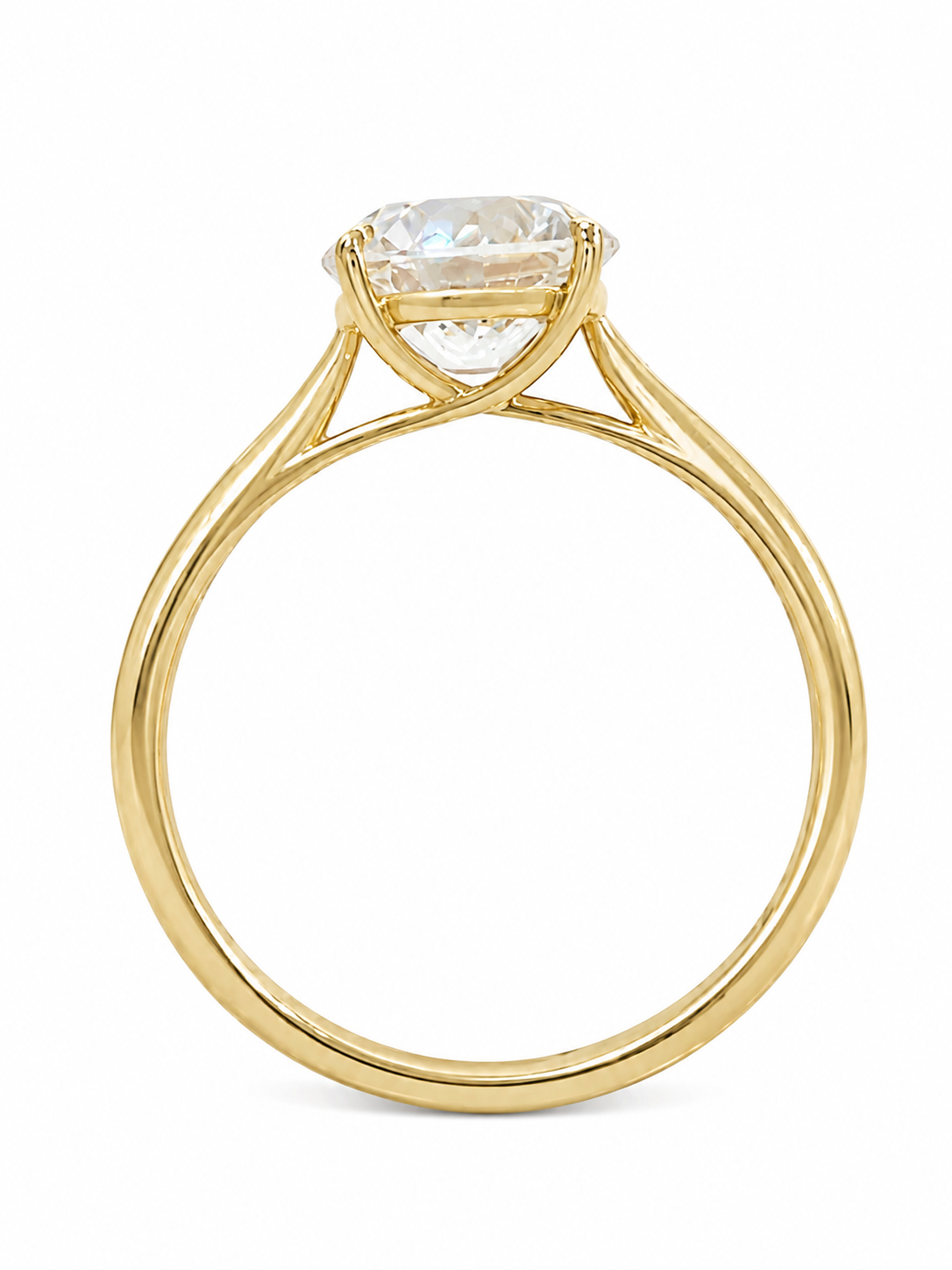A yellow gold solitaire engagement ring featuring a round brilliant-cut diamond gemstone in a four-prong setting, shown on a clean white background.