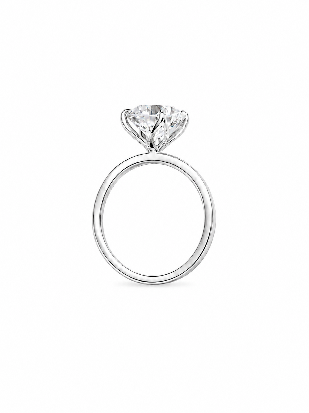 A white gold solitaire engagement ring with a round brilliant-cut diamond, shown from a top-down view on a white background.