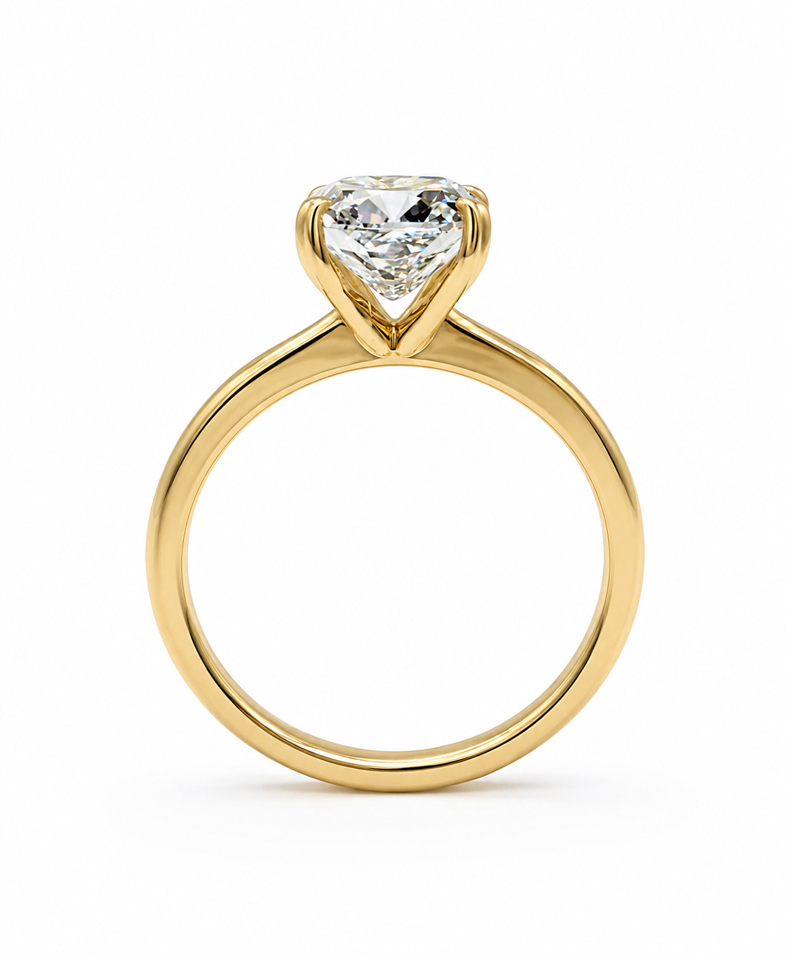 A yellow gold solitaire engagement ring featuring a cushion-shaped diamond gemstone in a prong setting, shown against a plain white background.