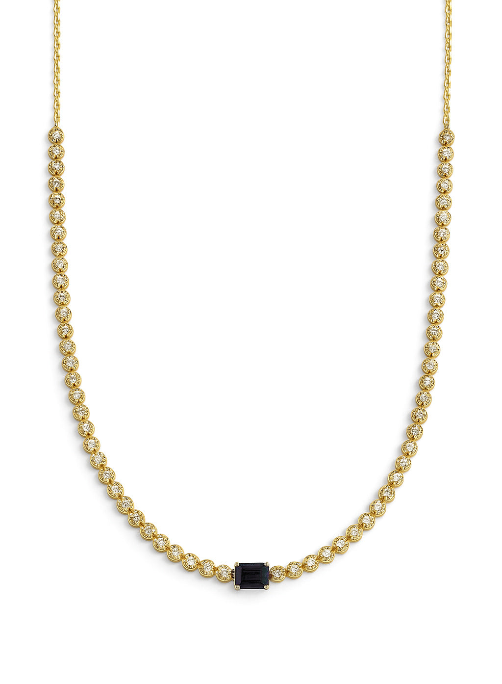 Gold necklace with a blue sapphire gemstone on a white background