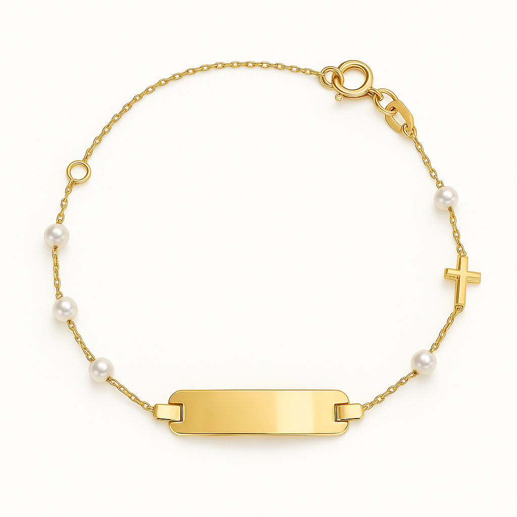 Gold bracelet with Identification Plate and pearls with accent cross on a white background