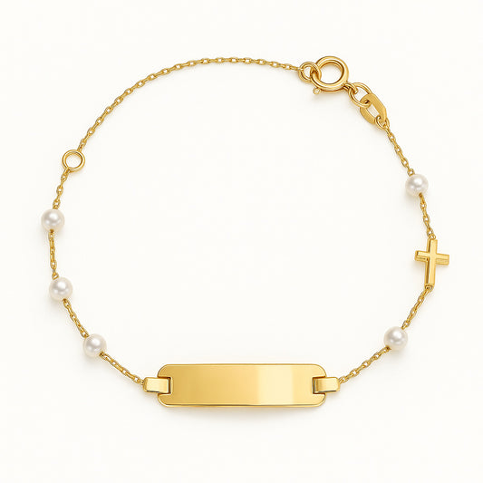 Gold bracelet with Identification Plate and pearls with accent cross on a white background