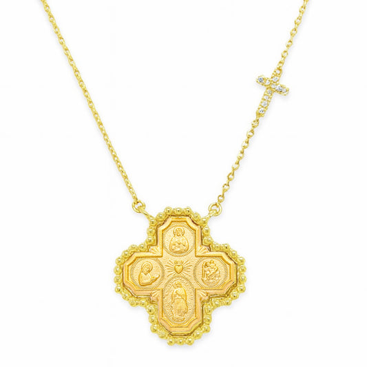 Gold necklace with a detailed cross pendant on a white background