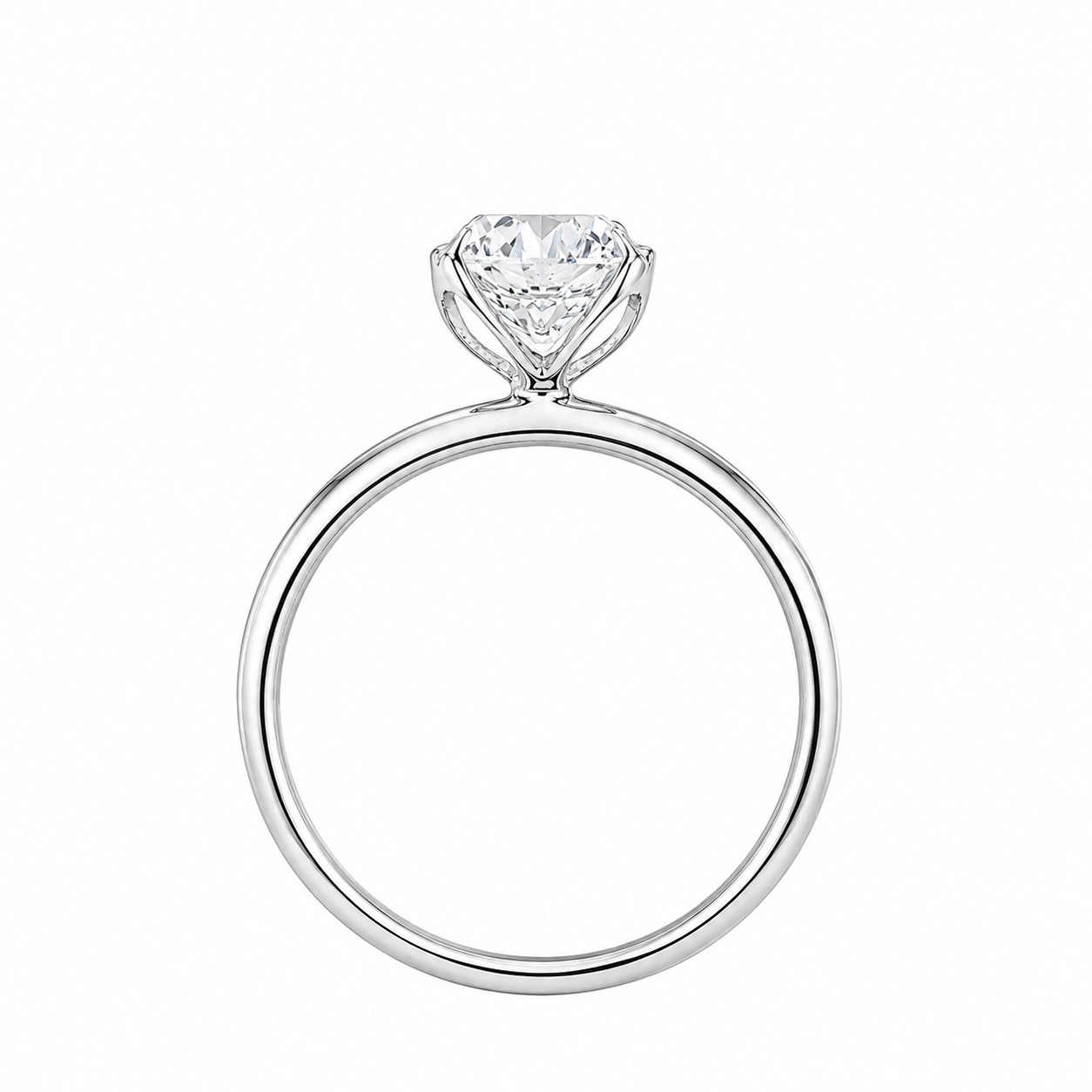 A classic solitaire engagement ring featuring a brilliant round-cut diamond set in a polished white gold metal band, shown against a plain white background.