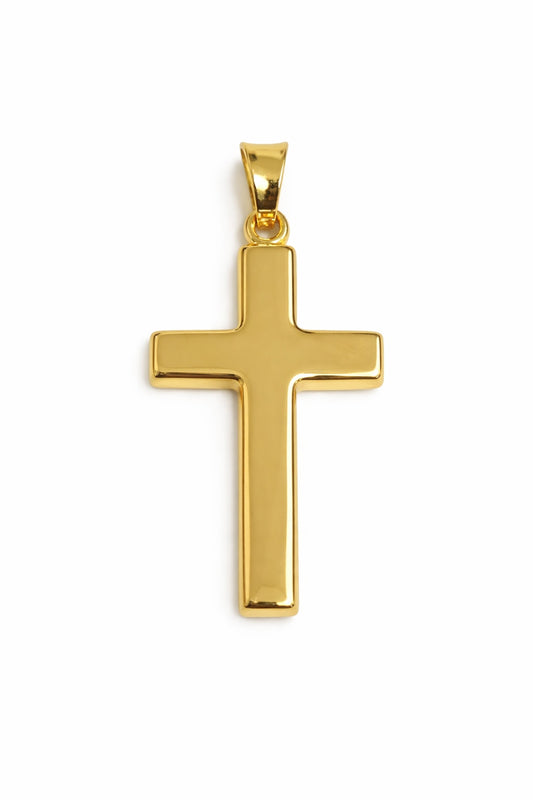 Gold cross pendant on a white background