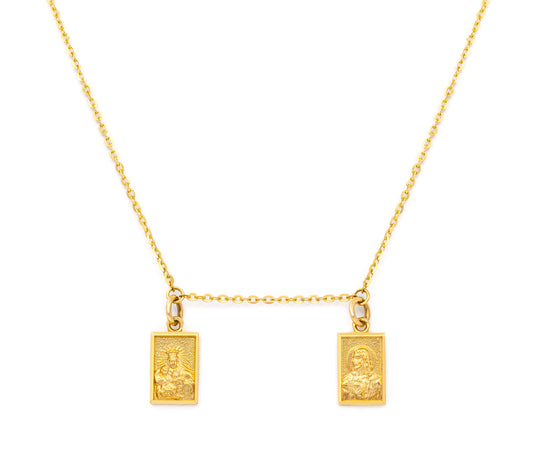 A 14 karat gold necklace featuring two double-sided scapular medals with one facing Our Lady of Mount Carmel and the other facing the Sacred Heart of Jesus, attached to a cable chain.