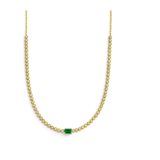 Gold necklace with a emerald gemstone and diamonds on a white background