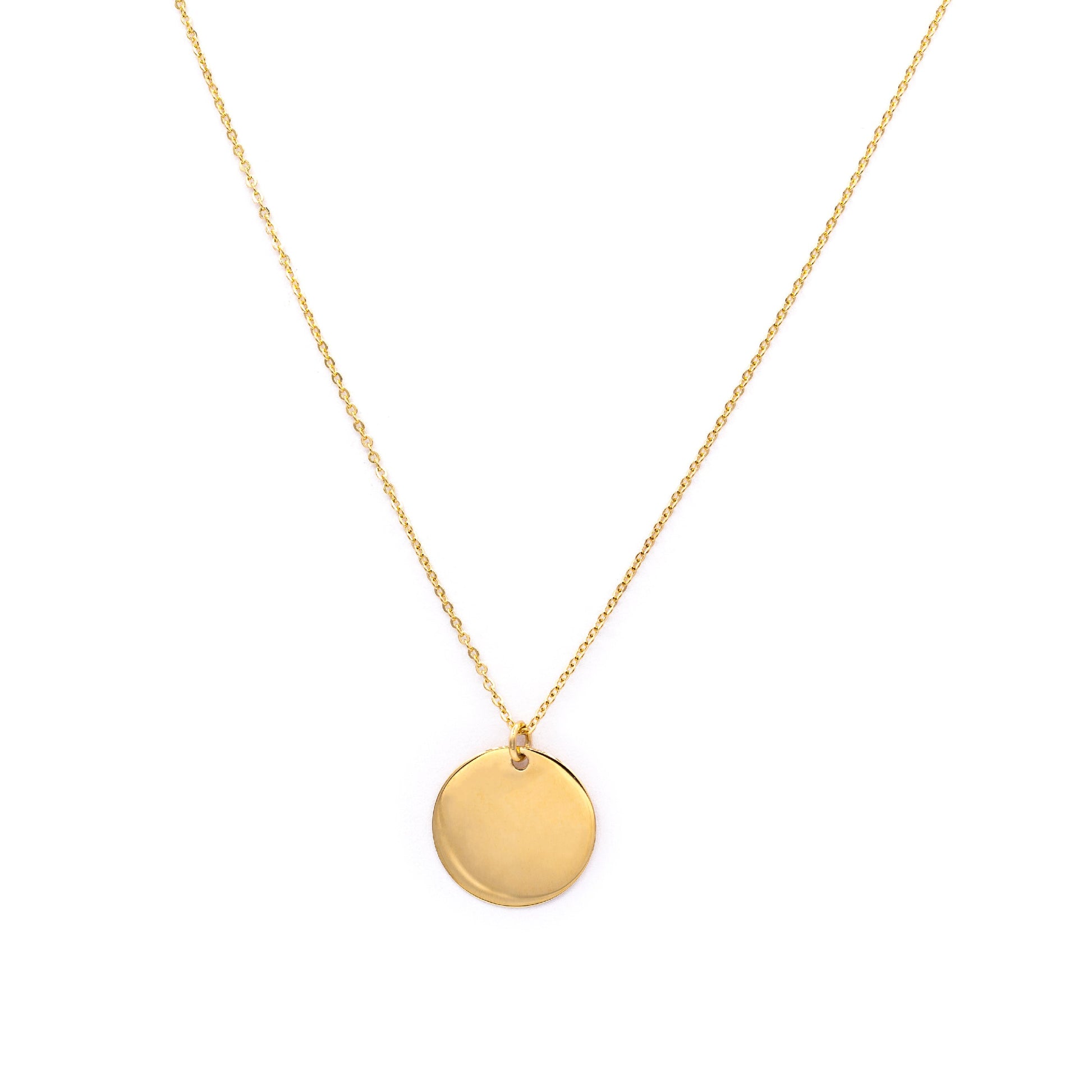 Gold necklace with a round pendant on a white background