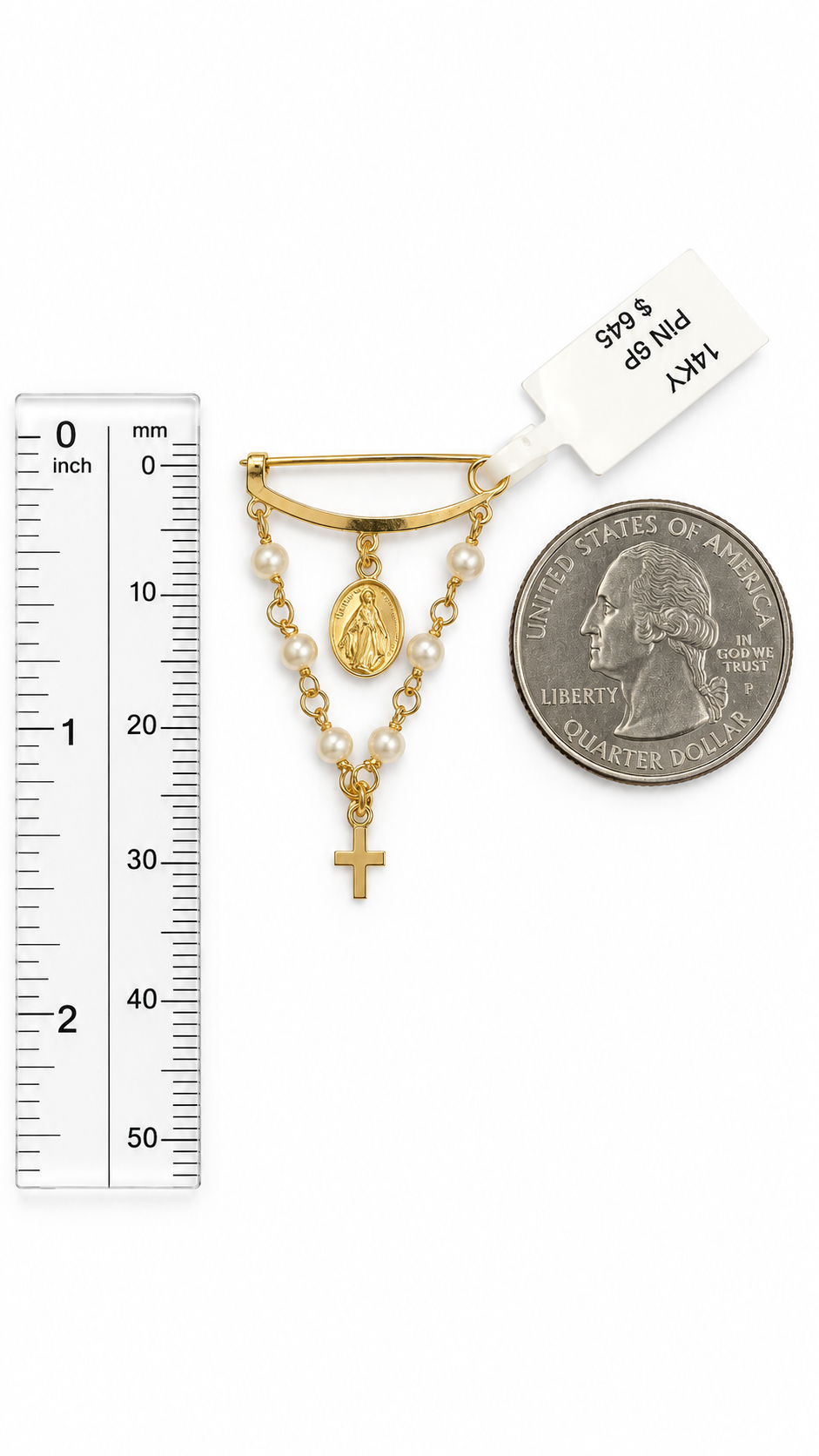 A gold and pearl religious pendant set shown on a white background with a ruler on the left and a U.S. 25 cent Quarter.