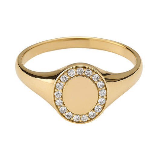 Gold ring with a oval circular signet design engravable center with diamond  halo  on a white background