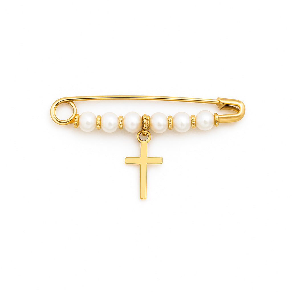 Gold brooch with pearl beads and a cross charm on a white background