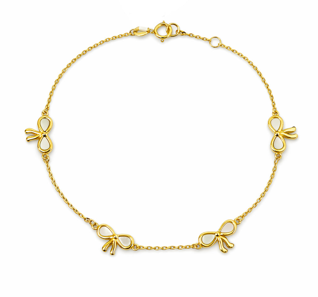 14k Gold bracelet with mother of pearl bow-shaped charms on a white background