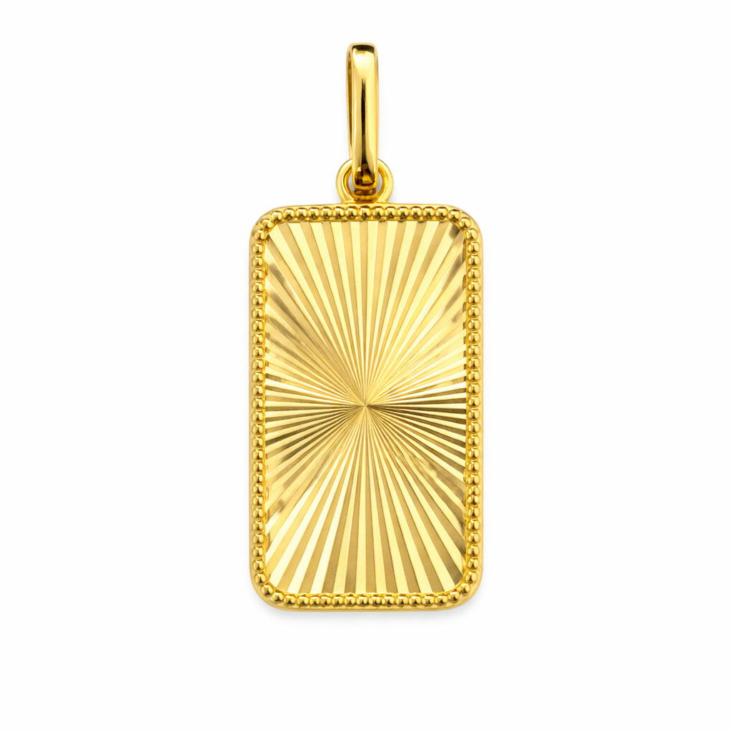 Gold rectangular pendant with sunburst fluted  design on a white background