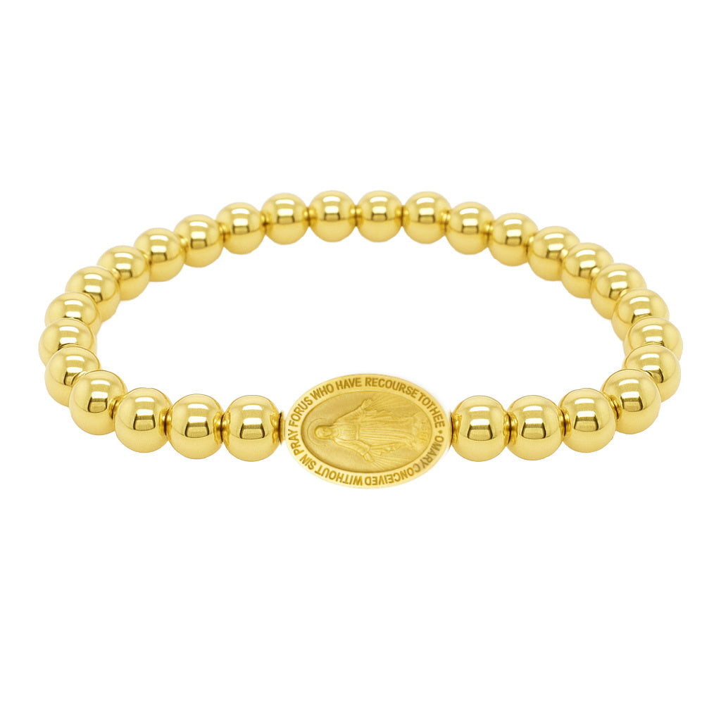 Gold beaded bracelet with a central medallion on a white background