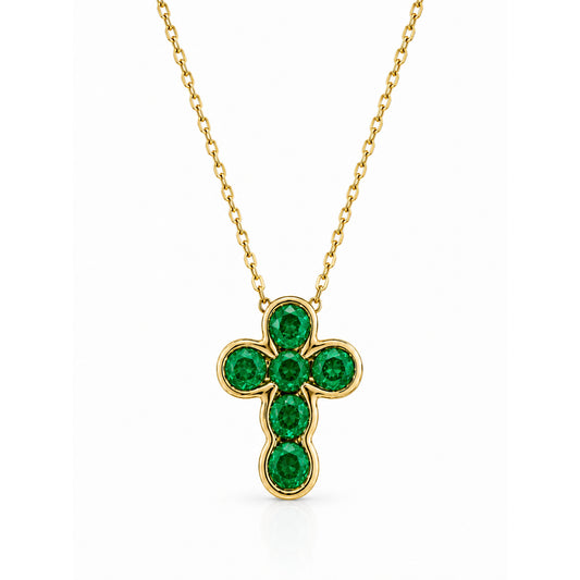 A gold cross pendant necklace featuring six faceted  green emerald gemstones, displayed on a clean white background.