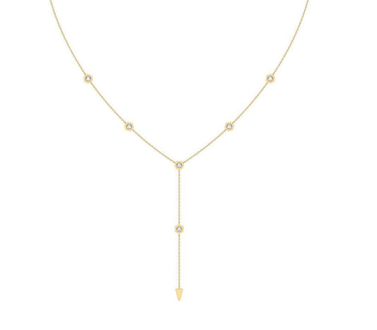 A delicate gold Y-necklace featuring five small round bezel-set diamond stones along the chain and a longer drop pendant ending in a pointed gold tip, shown on a plain white background.