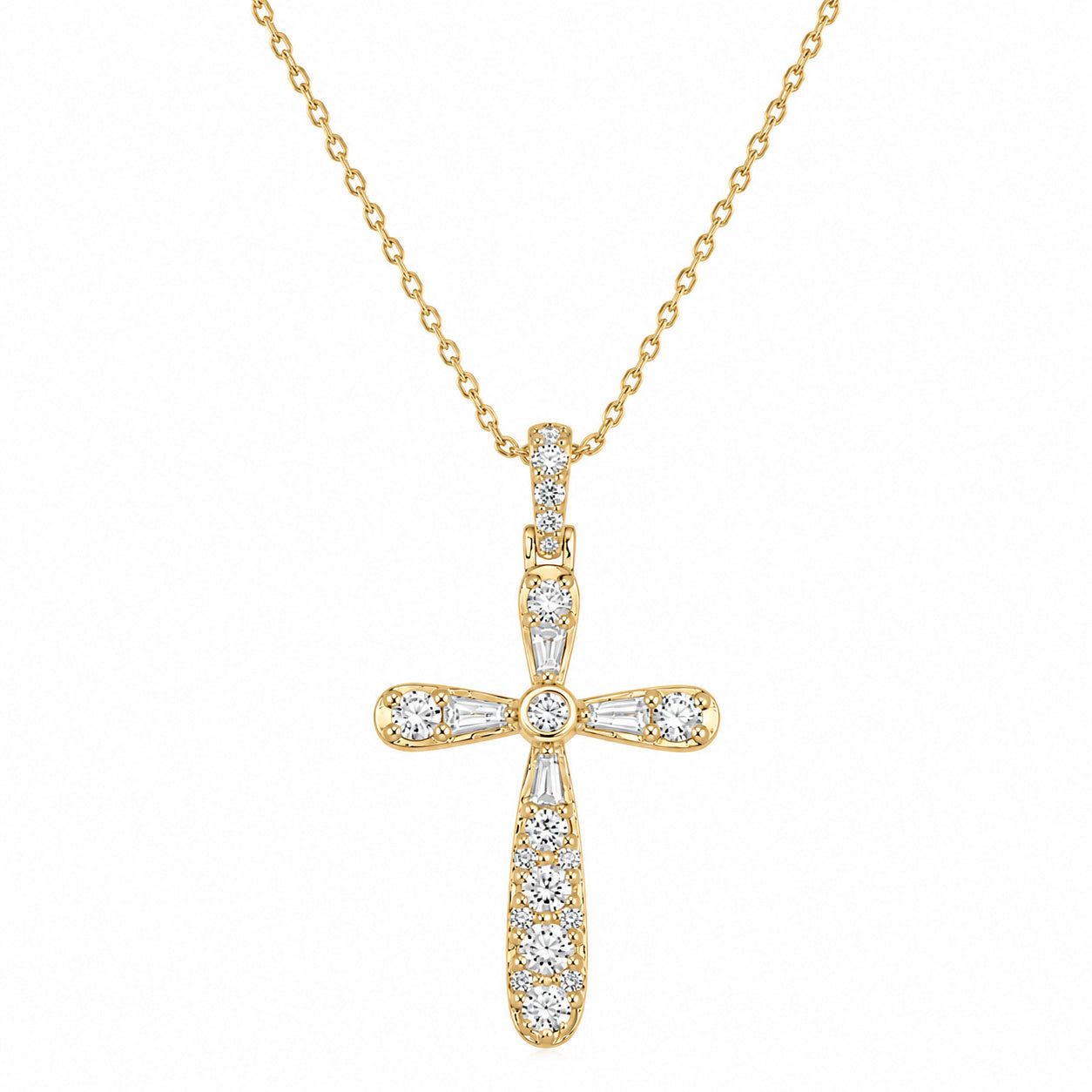 A gold cross pendant necklace adorned with clear baguette and round-cut diamond stones, suspended from a delicate gold chain against a solid white background.