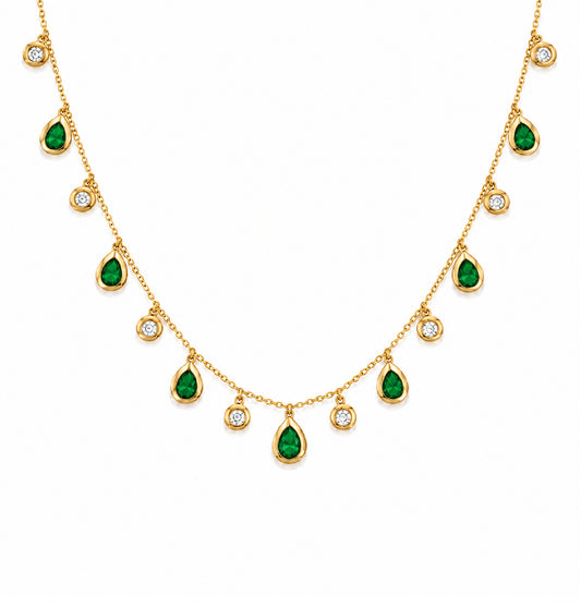 A gold chain necklace featuring multiple green teardrop-shaped emerald-cut gemstones and small round diamond stones, displayed on a clean white background.