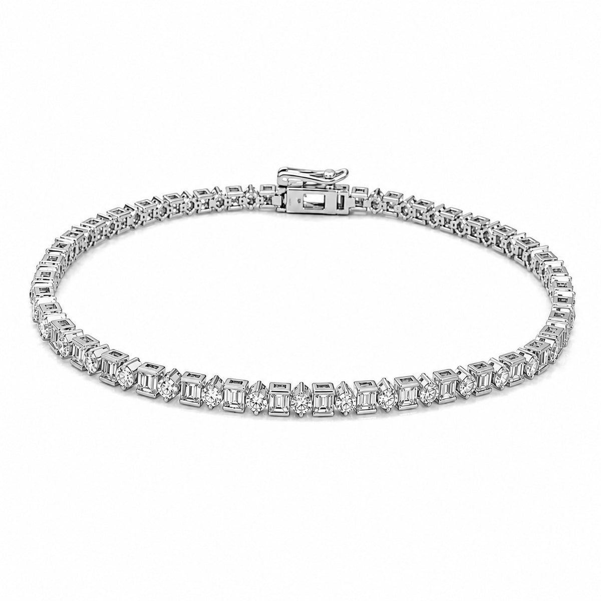 A 14K white gold tennis bracelet featuring baguette-cut and round cut natural diamond gemstones in a continuous row, displayed on a clean white background.