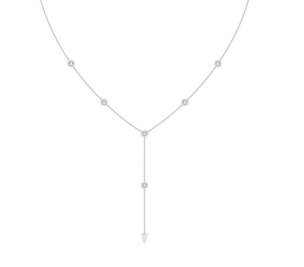 A delicate white gold Y-necklace featuring five small round-cut diamond gemstones, with a drop chain ending in a pointed triangular pendant, shown on a plain white background.