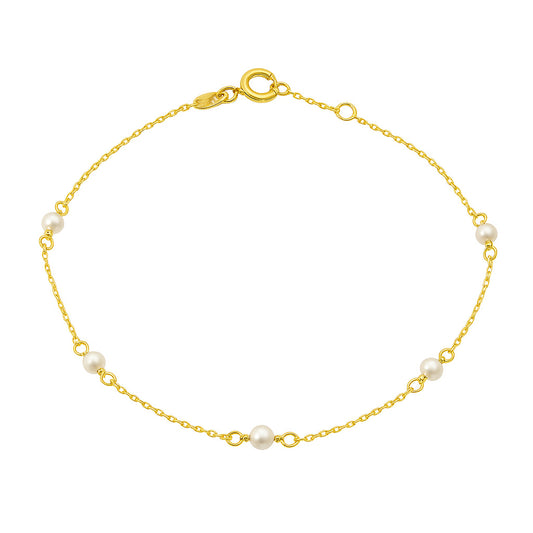 Gold bracelet with pearls on a white background
