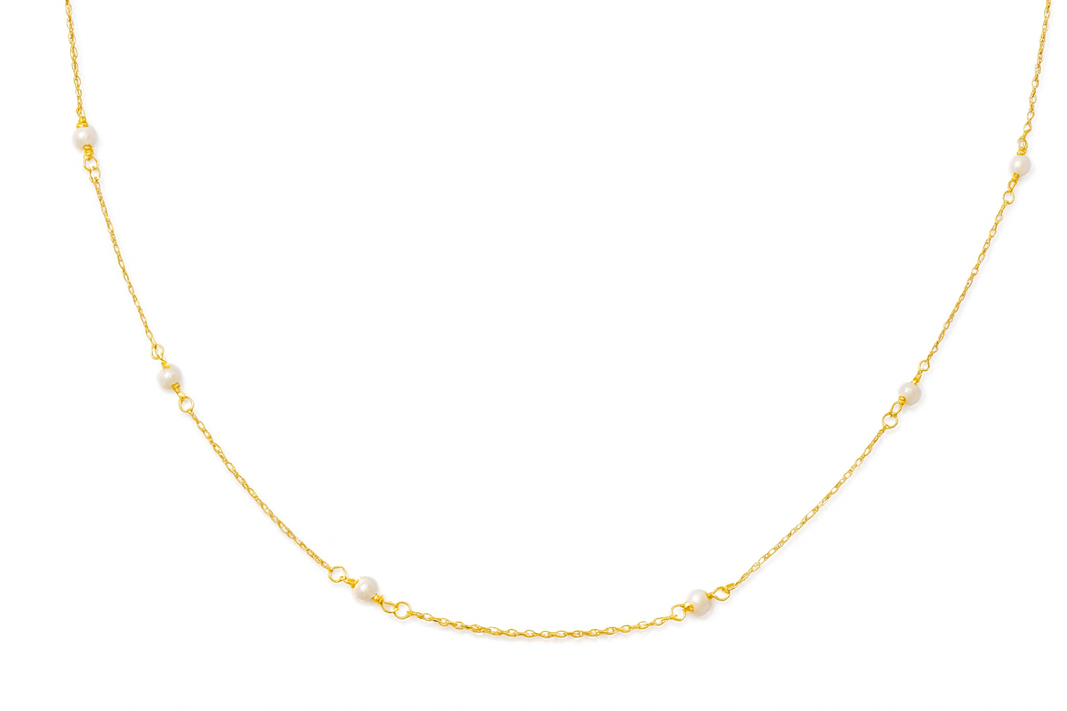 Gold necklace with small pearls on a white background