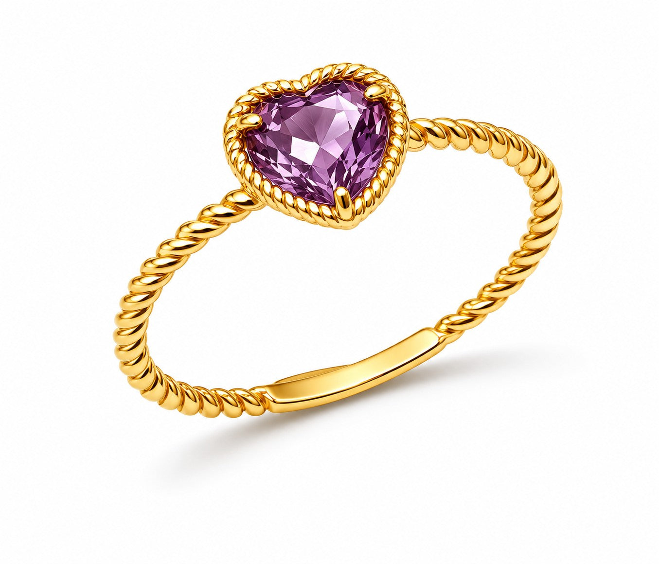 Gold ring with a heart-shaped purple amethyst gemstone on a white background