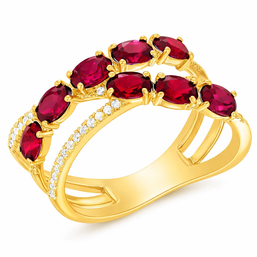 Gold ring with red ruby gemstones on a white background
