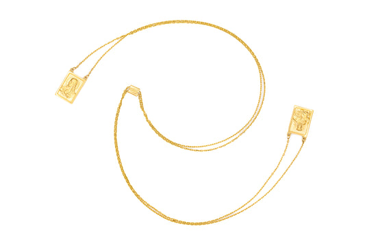 A large double medal scapular necklace made of 14K yellow gold, with square scapular medals on a yellow gold chain.