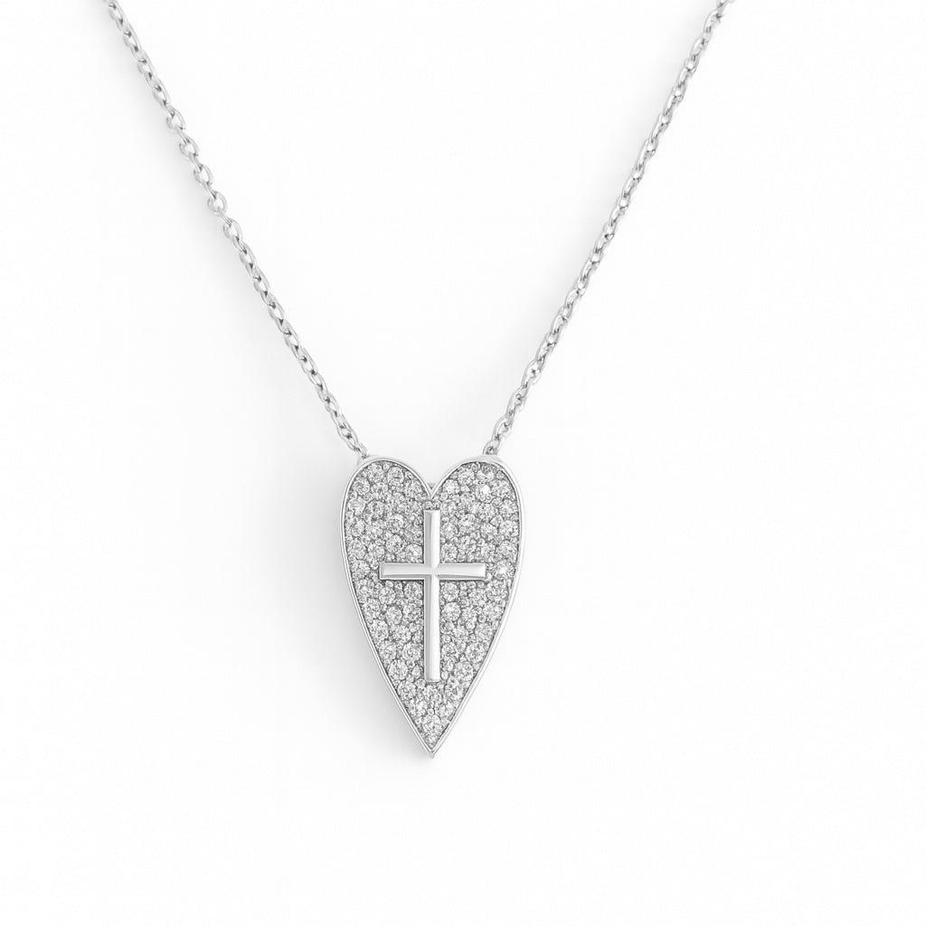Heart-shaped necklace with a cross design on a white background