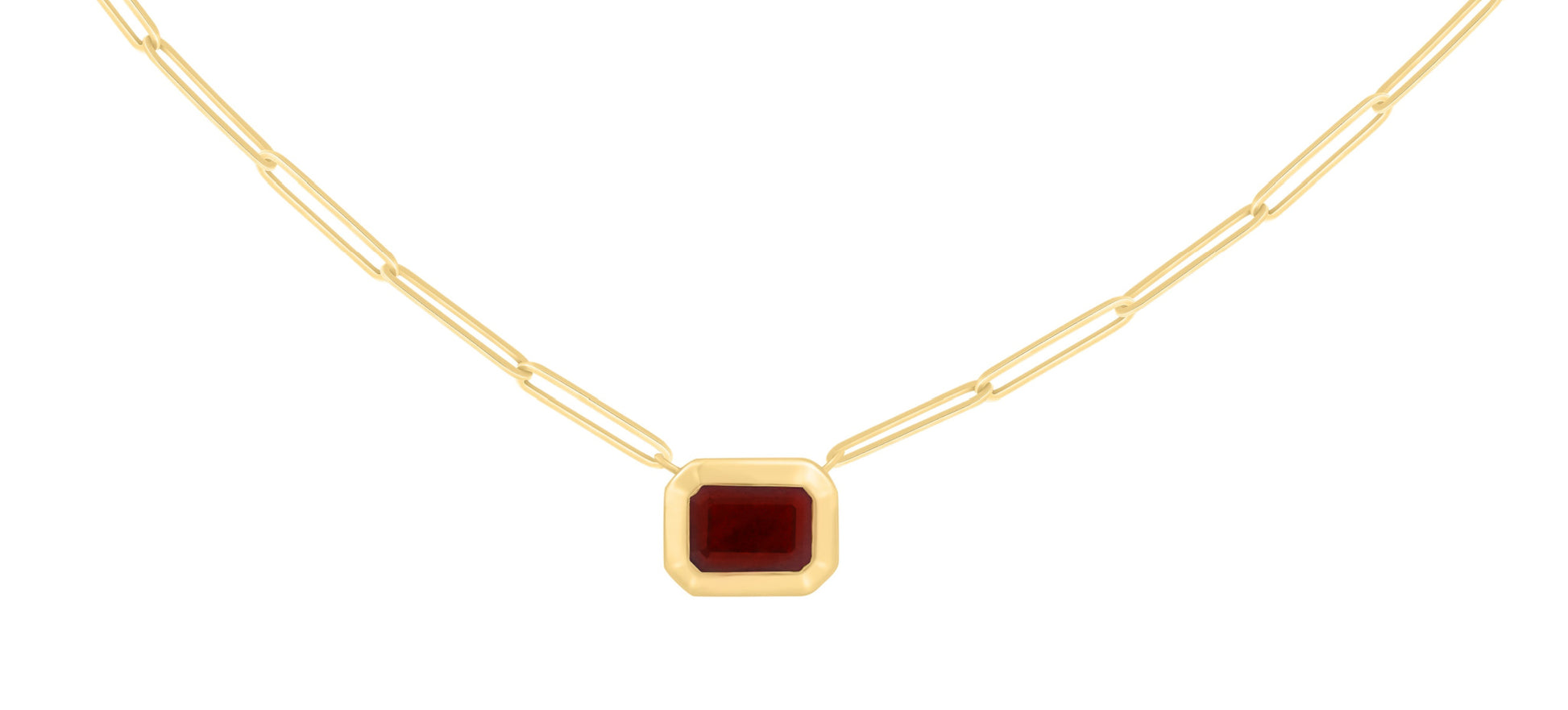 A 14K gold necklace featuring a bezel set step-cut Ruby color stone pendant on a paper clip chain.
