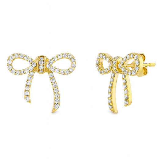 Gold bow-shaped earrings with diamond gemstones on a white background