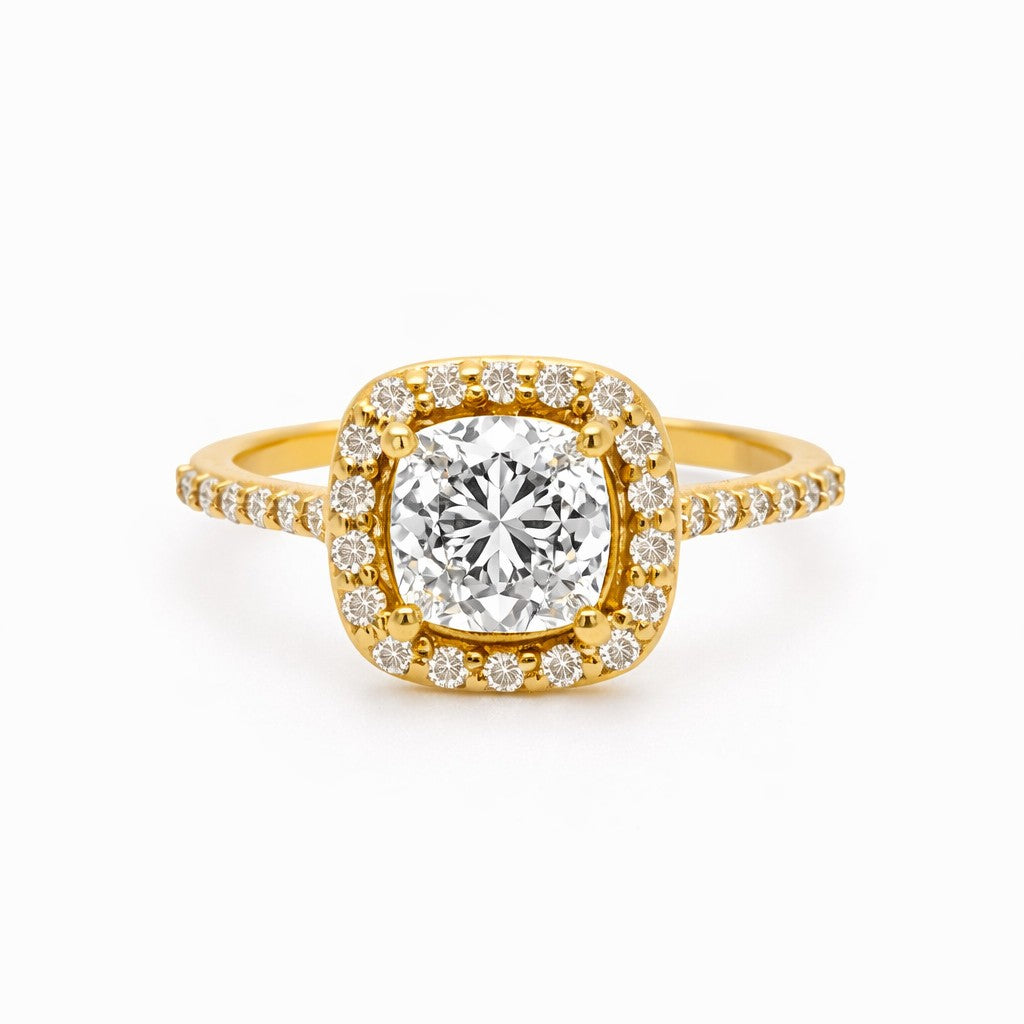 Yellow Gold Cushion Halo Engagement ring with pave diamond on a white background