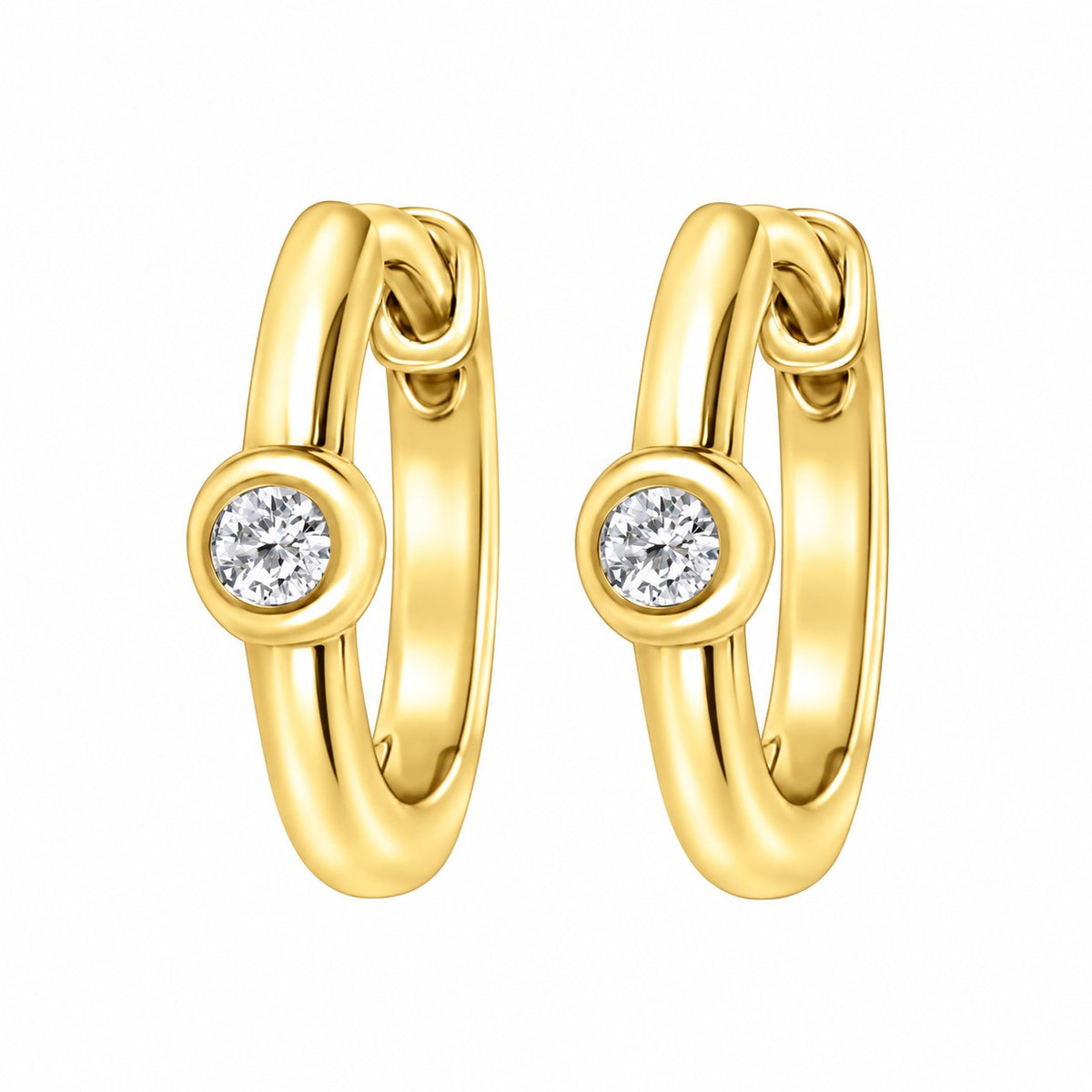 A pair of gold huggie hoop earrings, each featuring a small bezel-set round diamond gemstone on the front, shown against a plain white background.
