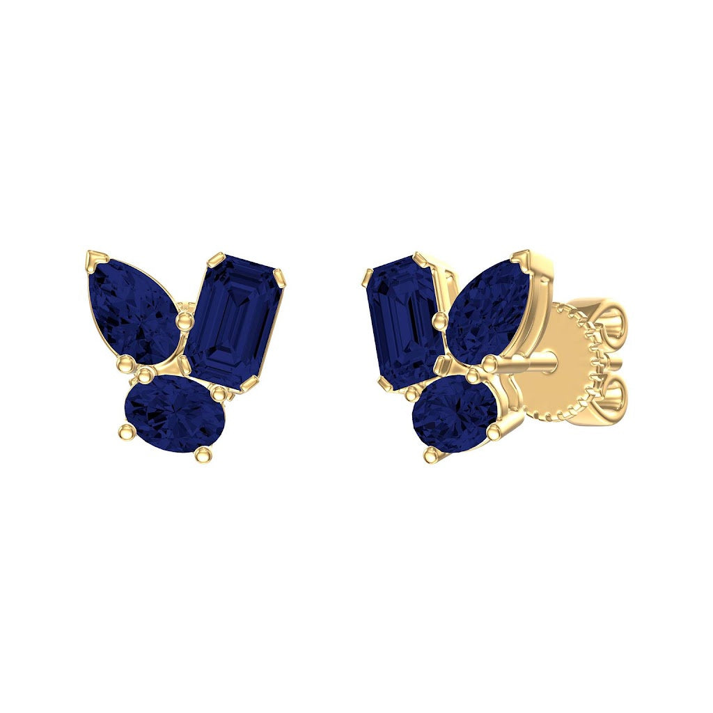 14K Gold earrings with blue sapphire gemstones on a white background